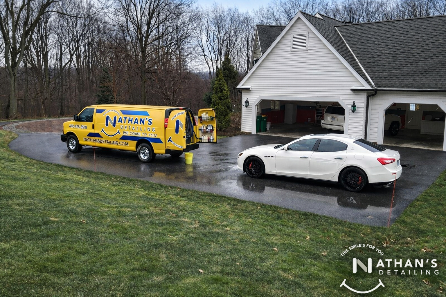 Detail van setup behind white sedan during mobile detailing in North Royalton