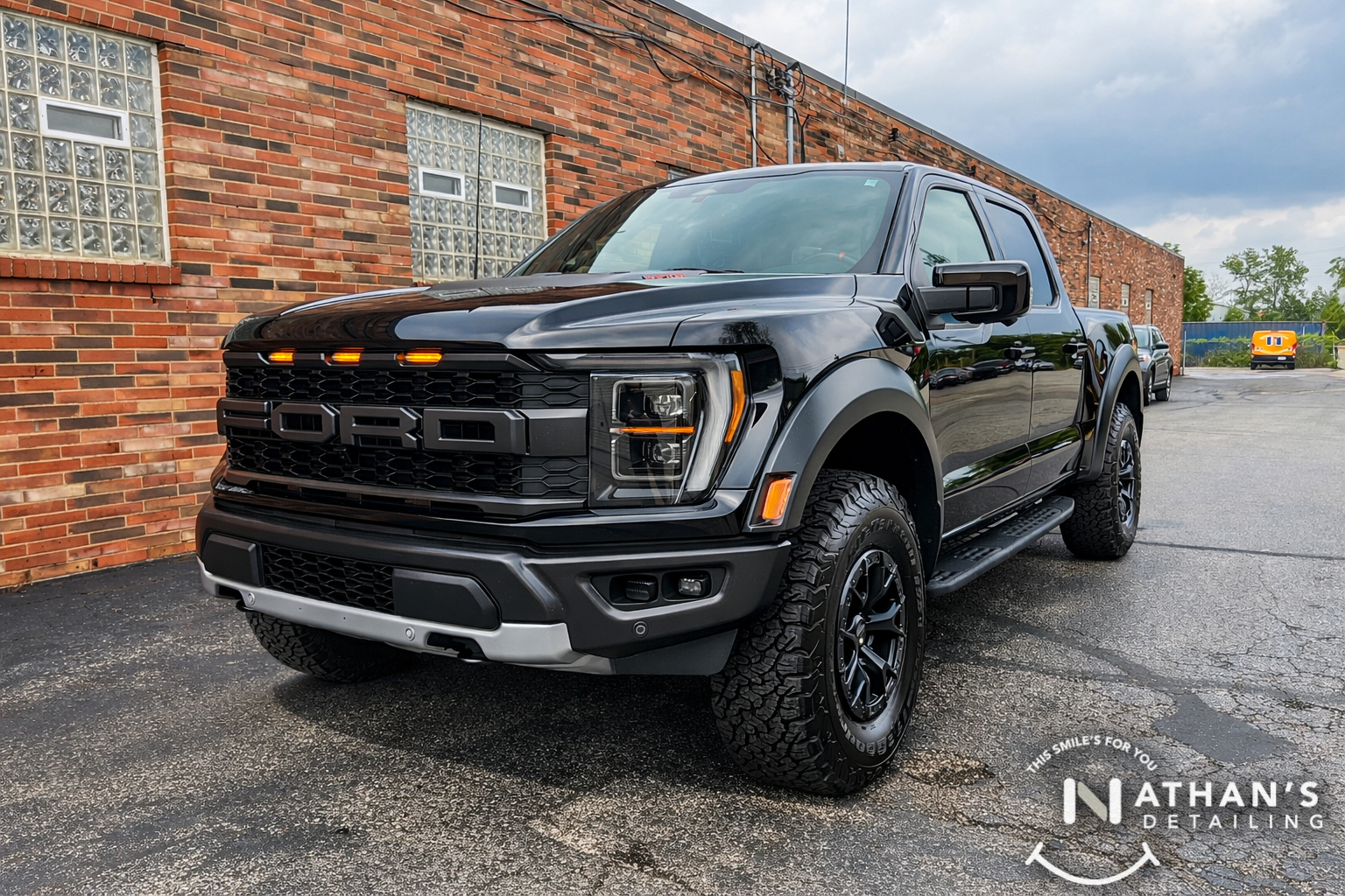 Ford Raptor parked outside with paint protection film protection.