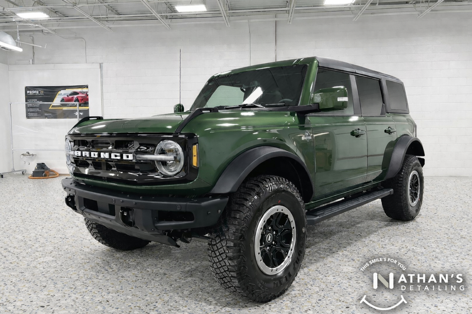 Green Ford Bronco shown indoors with paint protection from ceramic coating.