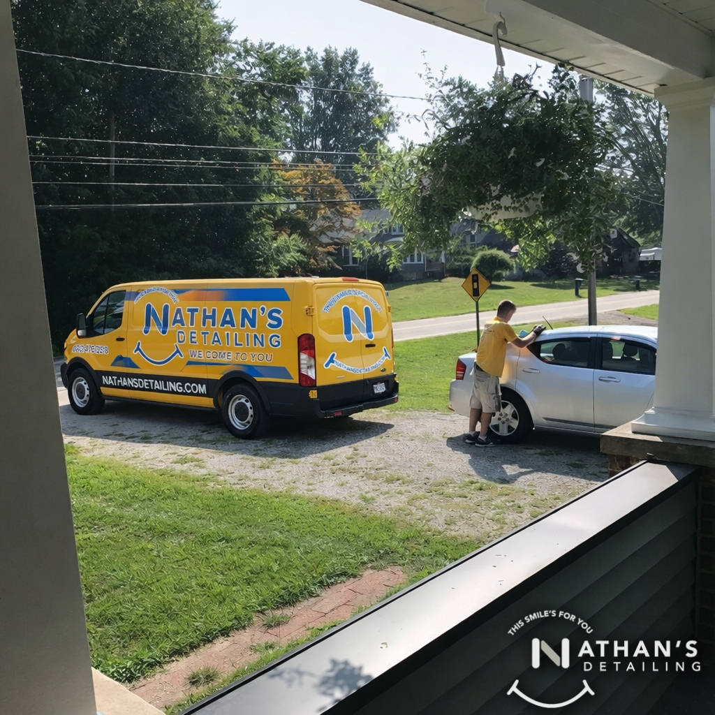 Mobile detailer wiping silver sedan driveway during mobile detailing in Shaker Heights