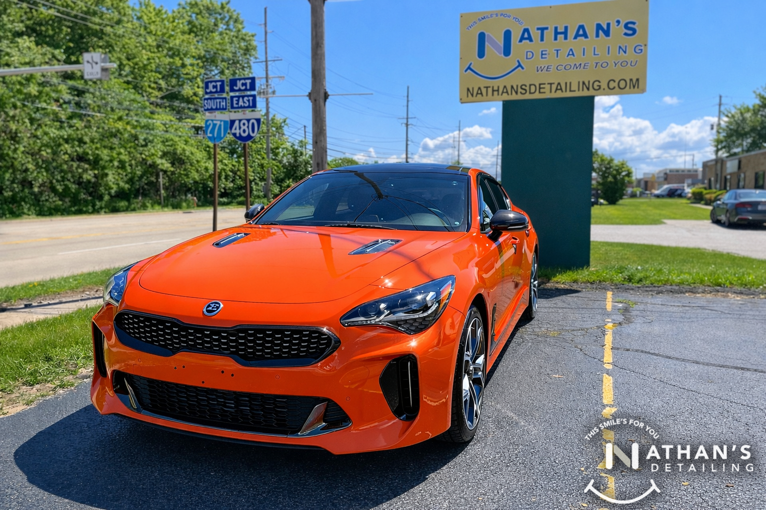 Orange sport sedan photographed outside with paint protection film protection in Strongsville, Ohio.