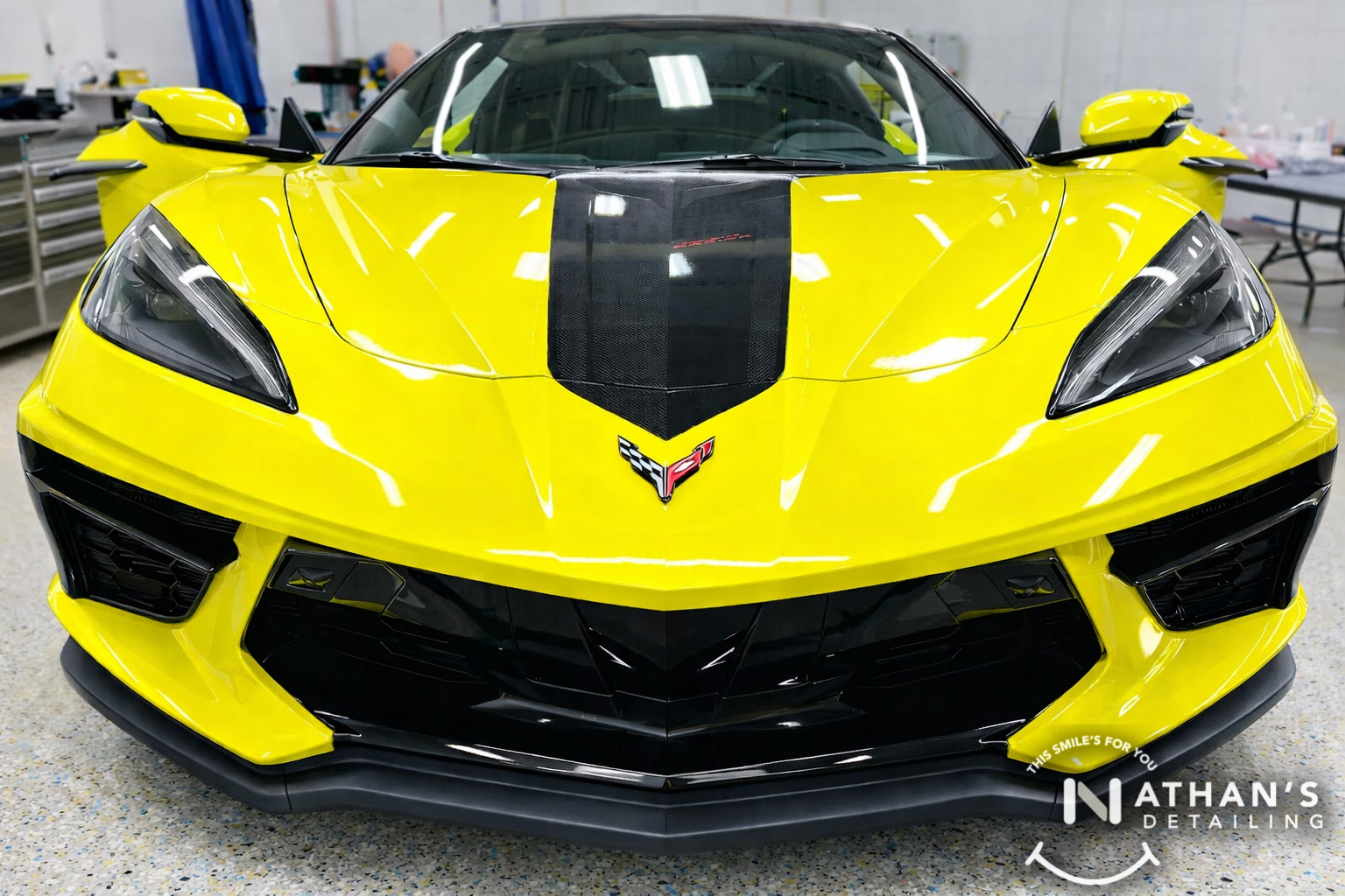 Yellow Corvette front end photographed indoors with paint protection film protection