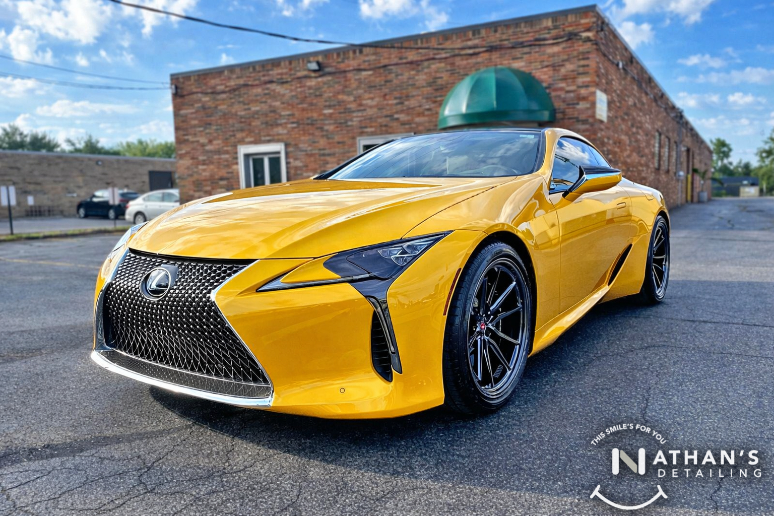 Yellow Lexus coupe photographed outside with paint protection film protection.
