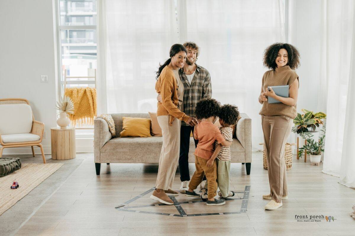Family standing in their new home they just purchased