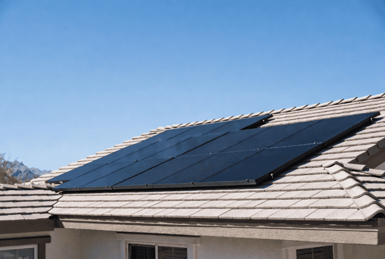 Elegant all-black Meyer Burger solar panels installed on a modern North Las Vegas rooftop under intense desert sun with heat haze