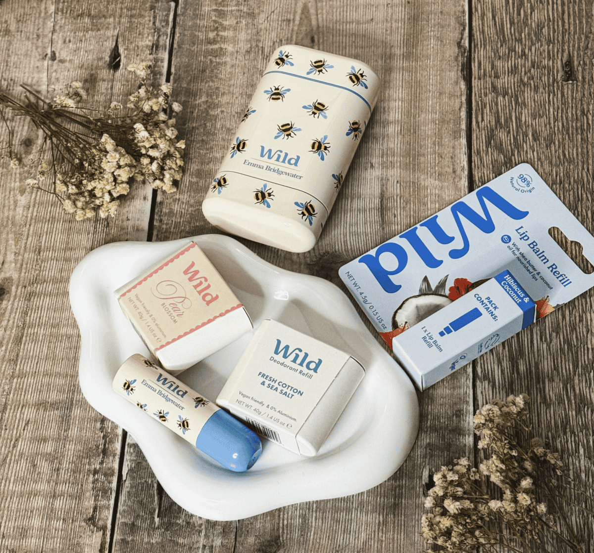 Wild Emma Bridgewater Bee Case deodorant, lip balm and refills laid out together
