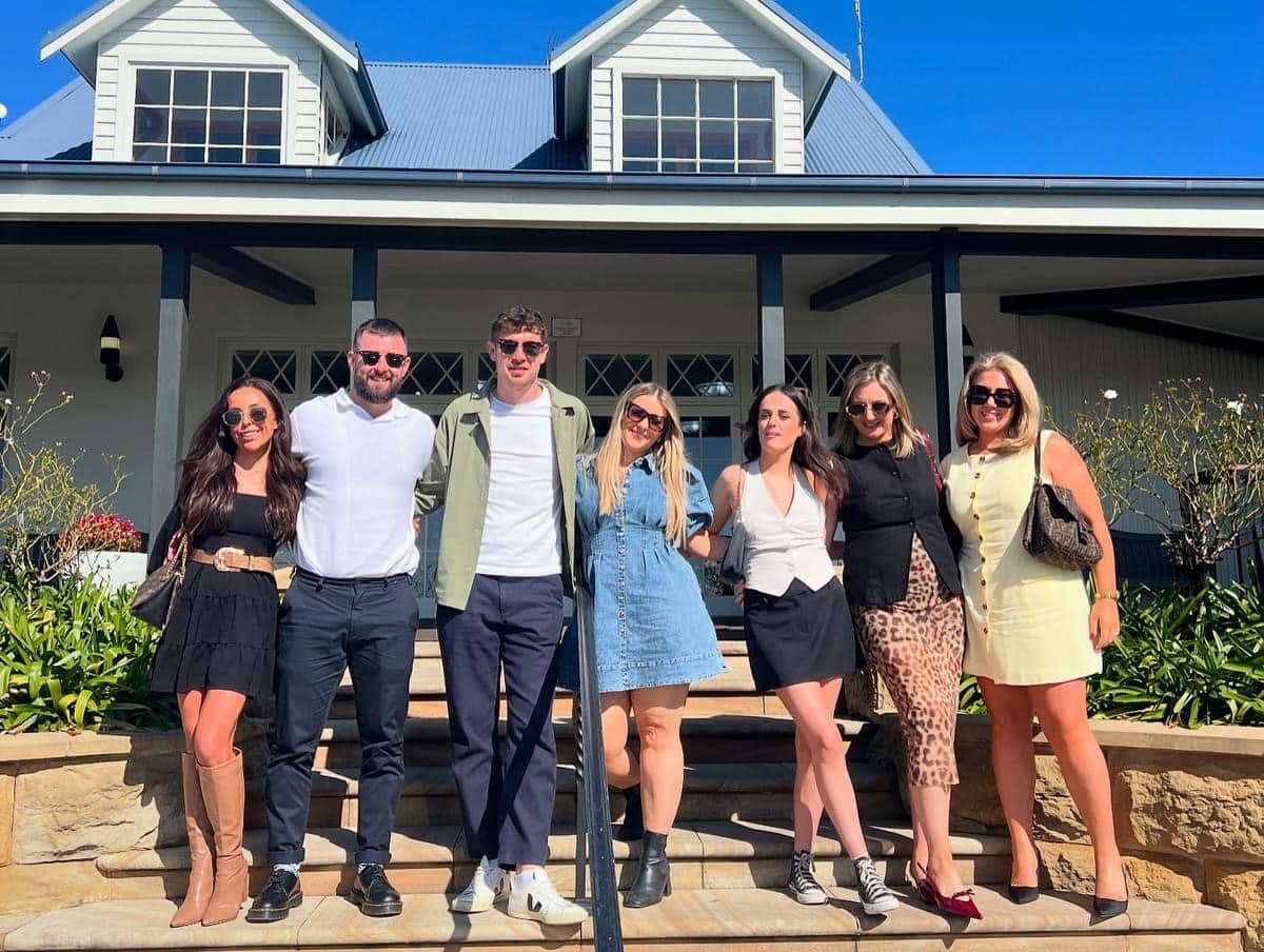 Group of friends enjoying a wine tasting tour at Hunter Valley vineyard estate in New South Wales.