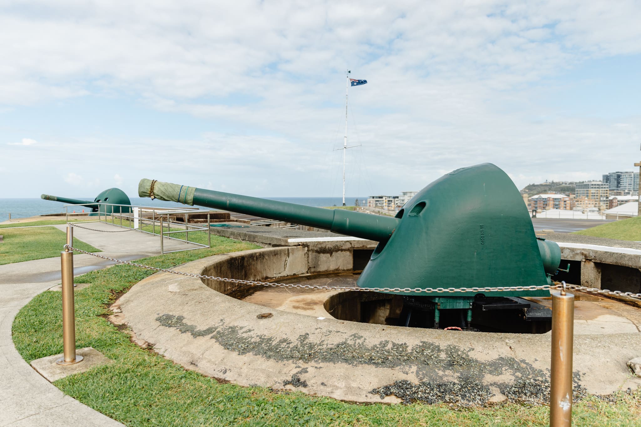 Large historic cannon at Nobbys Head, Newcastle, Australia, overlooking the ocean, part of the city's maritime history exhibit, perfect for sightseeing and exploring local heritage.