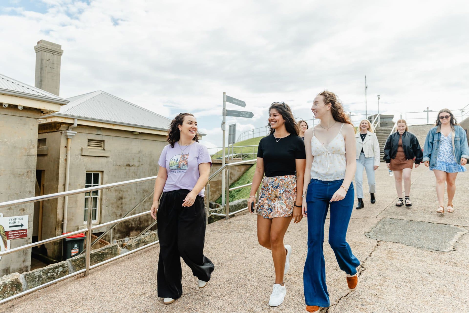 Vibrant group of young women enjoying a guided tour in Newcastle, Australia, showcasing Newy Tour Co.'s popular sightseeing experiences and excursions for travelers and locals alike.