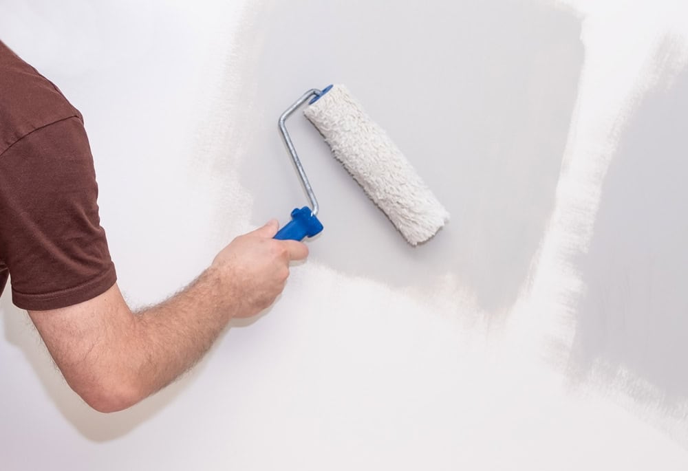 Painting the walls to refresh the space with a new coat of color.