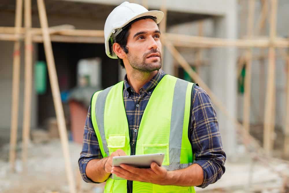 Building inspector assessing the project's progress.