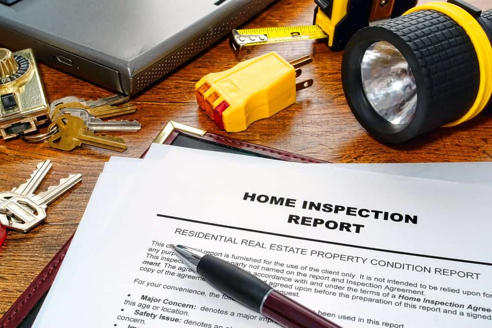 Tools and documents ready for a thorough home inspection.