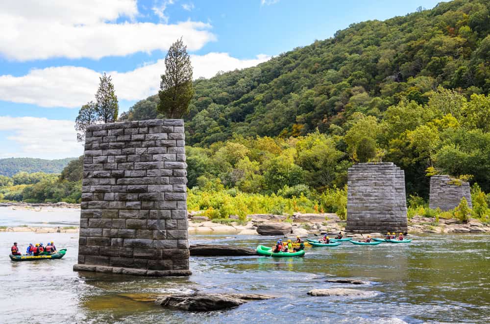 Kayakers embark on an adventure around the historic stone piers of the Potomac River at Harpers Ferry.