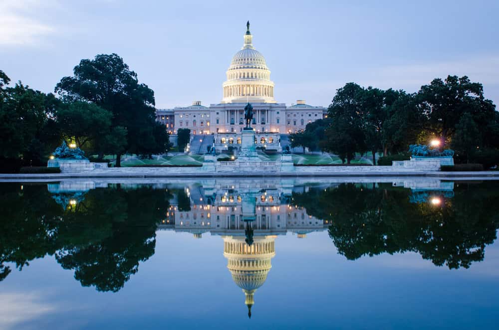 Washington DC The US Capitol Building reflected in the still waters of the reflecting pool at dawn in Washington, D.C.
