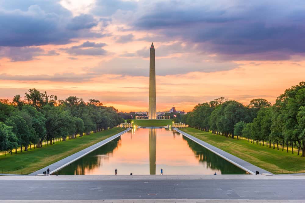Sunset over the Washington Monument in Washington DC, reflecting in the serene waters of the Lincoln Memorial Reflecting Pool.