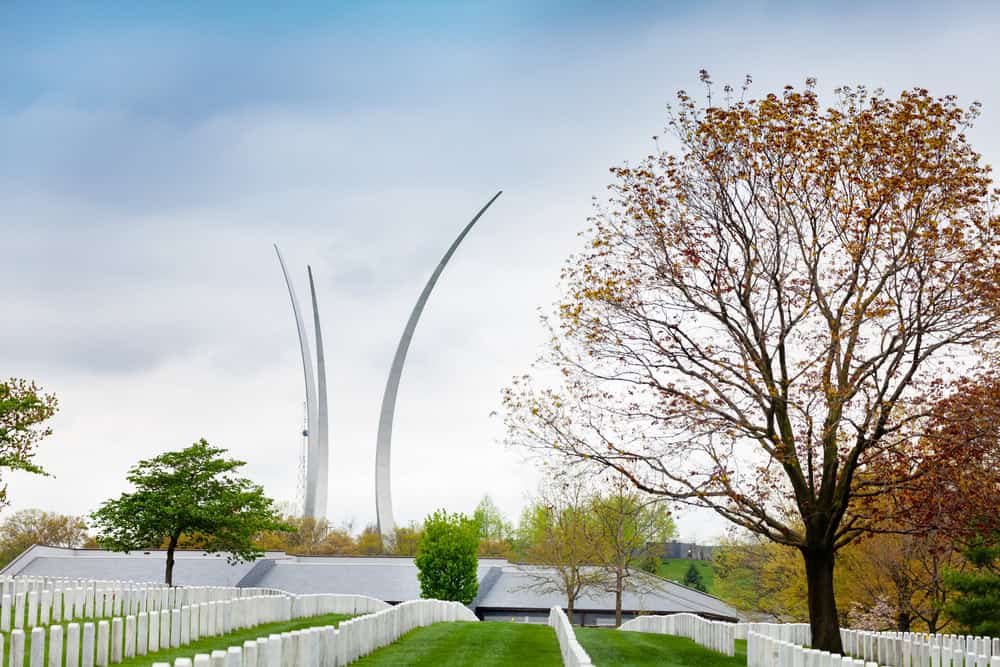 A serene view of the United States Air Force Memorial soaring above Arlington National Cemetery.