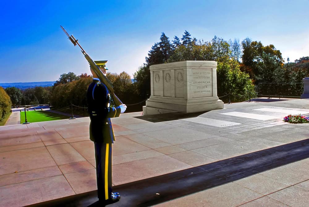 Guard standing watch at the Tomb of the Unknown Soldier, Arlington National Cemetery, honoring America's fallen unidentified service members.