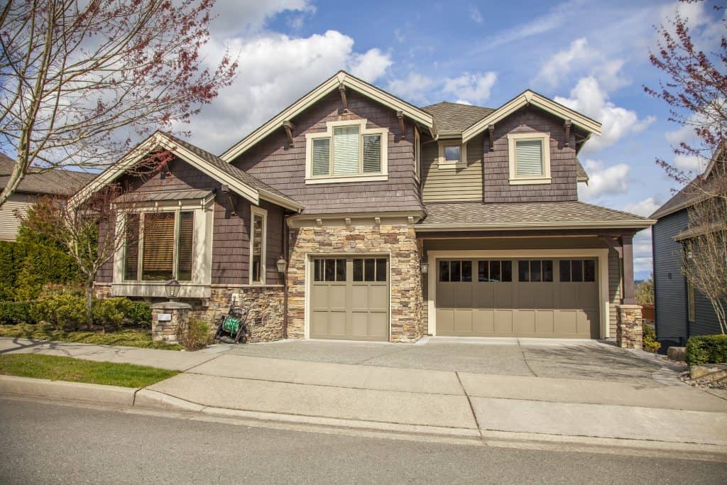 Charming suburban home with a modern rustic design and beautifully landscaped yard.