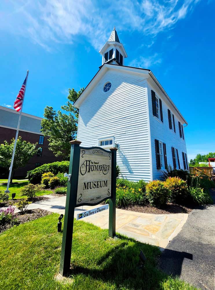 Historic Charm: The Haymarket Museum Welcomes Visitors Under Clear Blue Skies