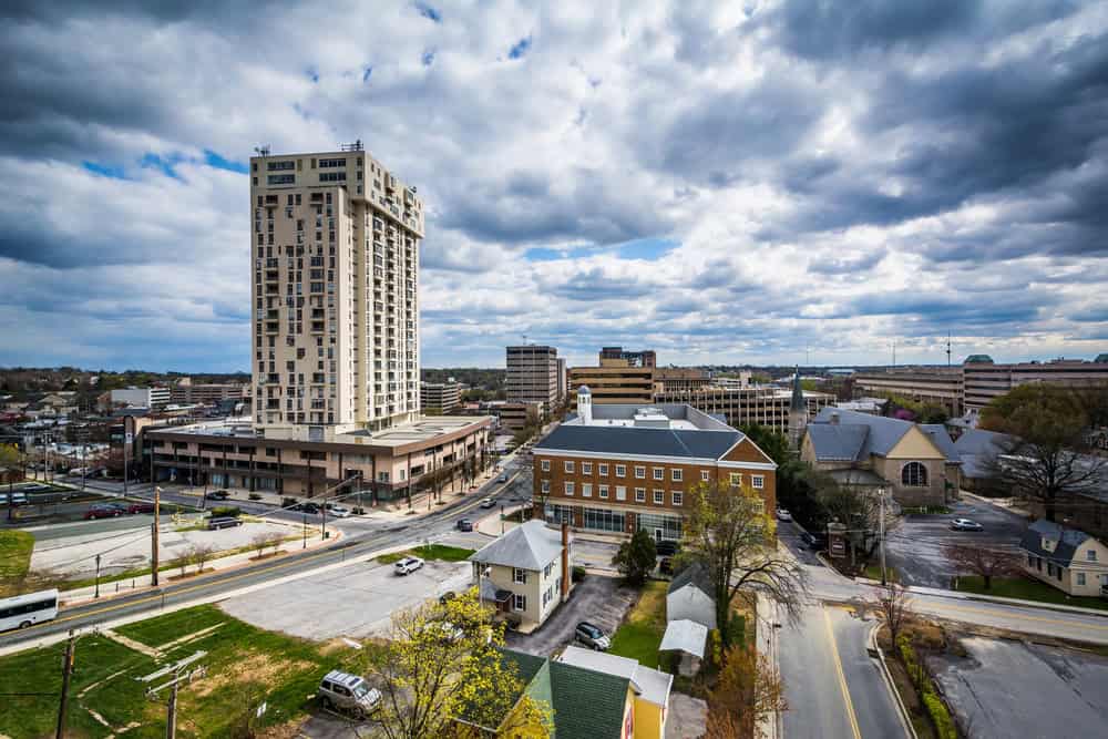 High-rise serenity meets small-town charm under a dramatic sky.
