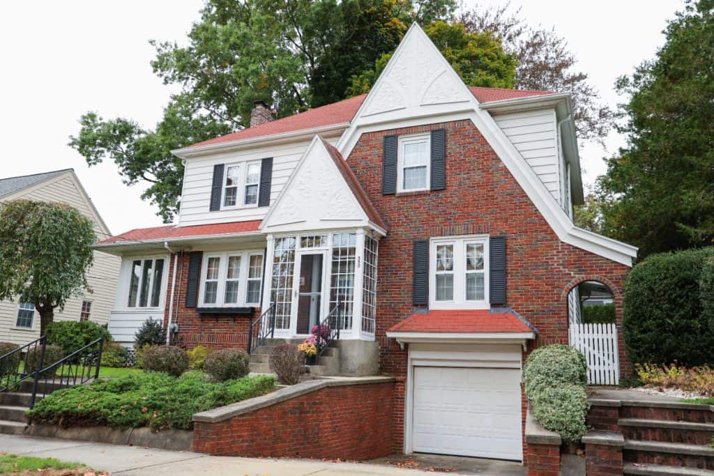 Charming Craftsman home nestled among lush greenery, inviting tranquility and timeless elegance.