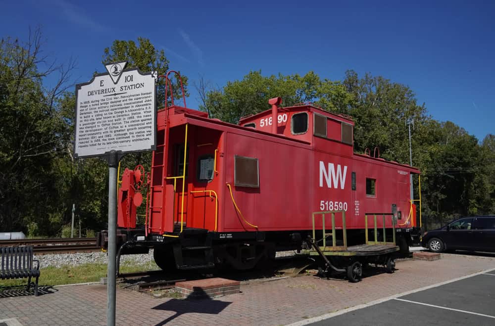 Clifton, Virginia's Devereaux Station: A historic red caboose, NW 518590, stands proudly near its historical marker.