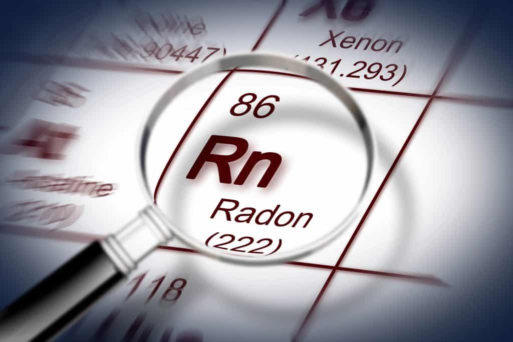 Magnifying Radon: Element 86 (Rn), the radioactive noble gas with atomic mass 222, spotlighted on the periodic table.
