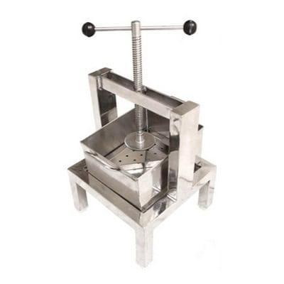 Heavy-duty cheese cutting machine for efficient dairy processing.