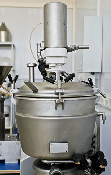 Heavy-duty stainless steel dairy equipment used for milk processing and production.