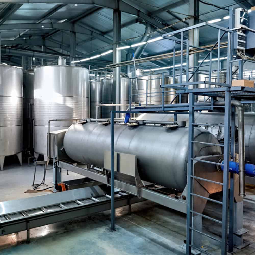 High-capacity stainless steel dairy processing tanks and equipment for efficient milk production.