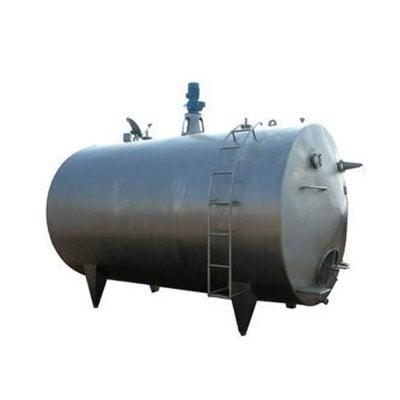 Large stainless steel dairy storage tank for milk processing and storage.