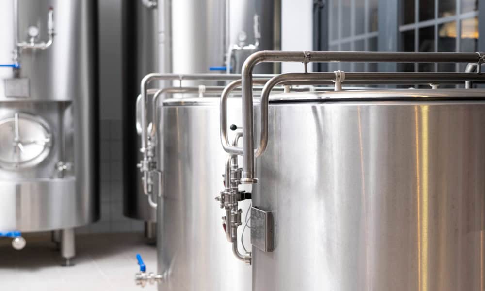 Stainless steel dairy storage tanks for milk processing and dairy farm equipment.
