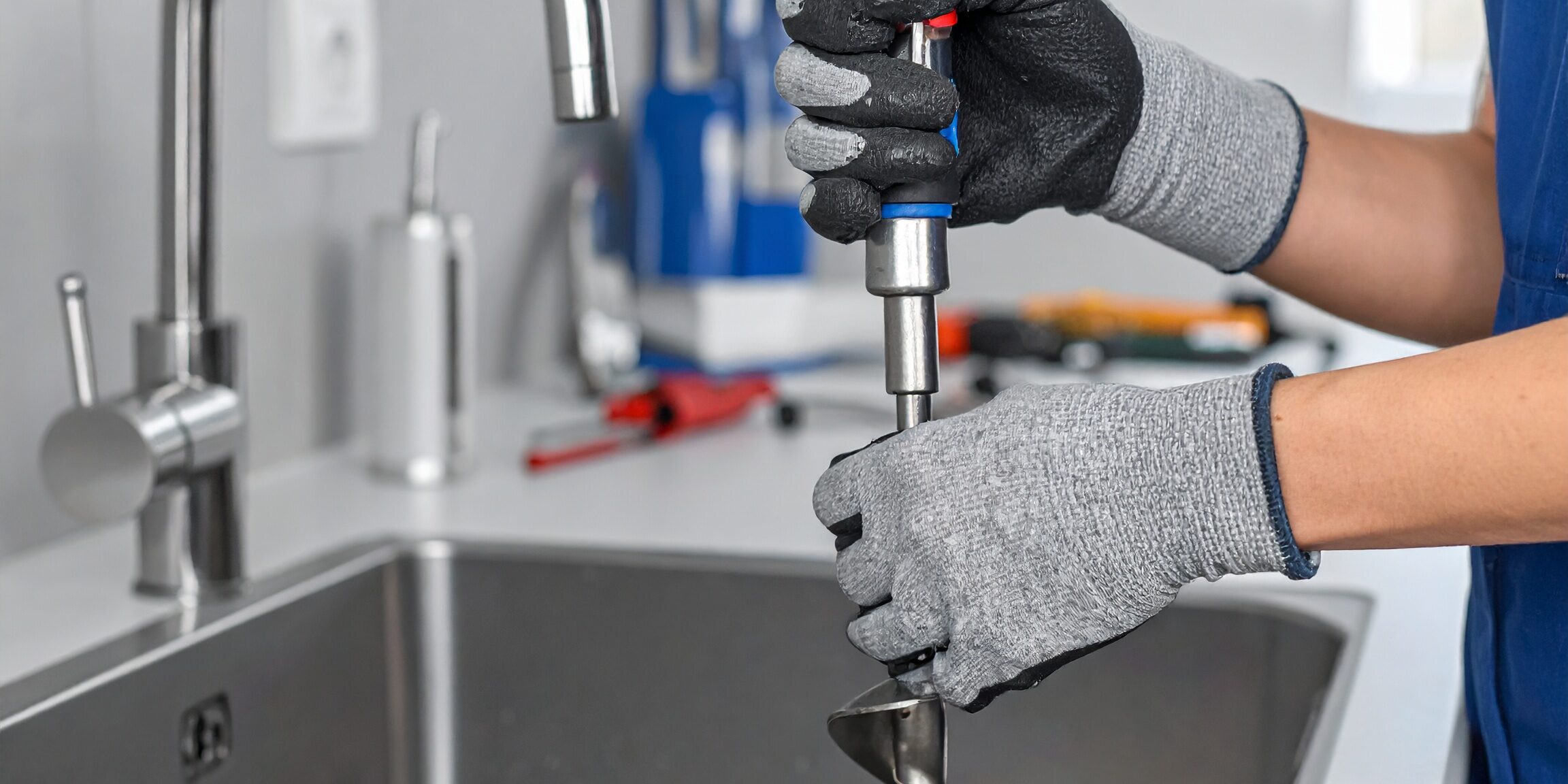Plumber-Fixing-Kitchen-Faucet-Installation