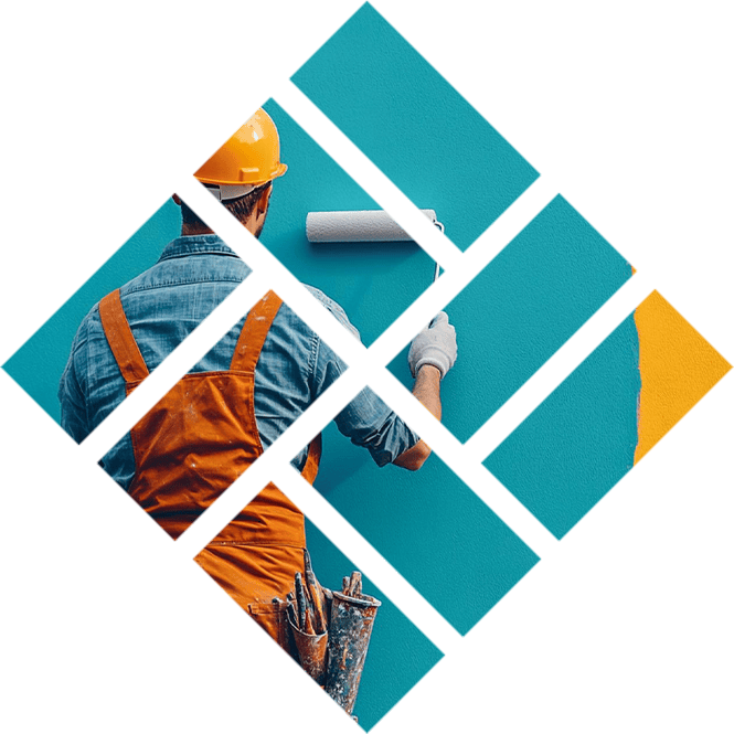 Painter applying blue paint on wall with roller brush in construction site.
