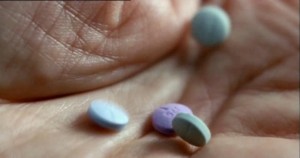 Sara starts popping the pills faster and faster to fit in that red dress.