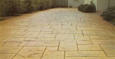 Slate impression concrete driveway in Melbourne featuring a natural stone finish with decorative slate pattern.