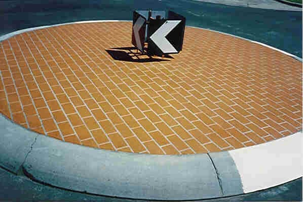 Decorative stencil concrete traffic island after resurfacing with clean finish and defined markings in Melbourne