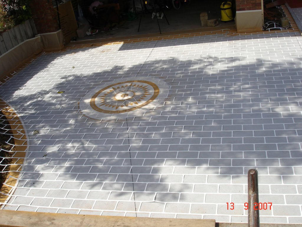 Stencil concrete resurfacing base coat application Melbourne driveway