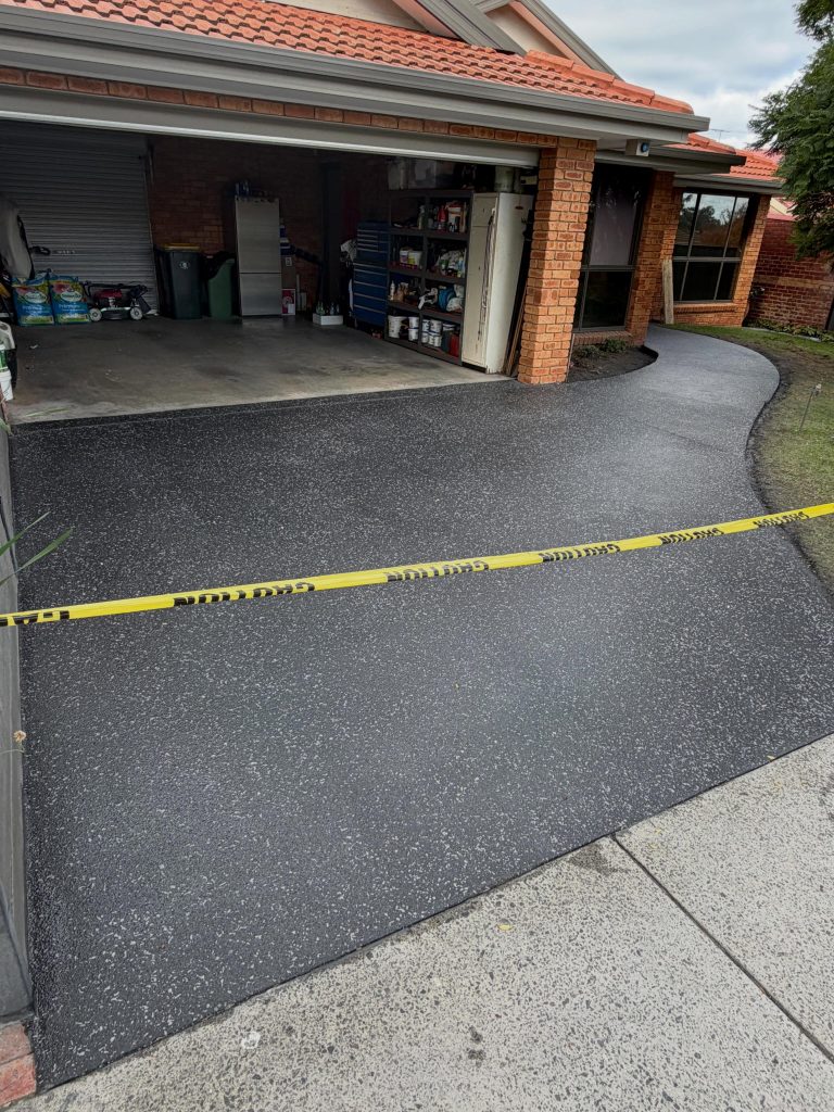 Exposed aggregate resurfaced driveway after grinding slippery slate concrete in Narre Warren
