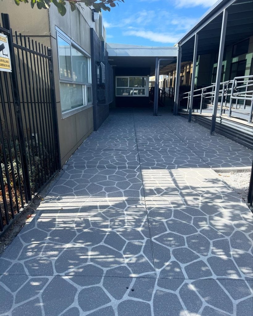Refinished school concrete walkway after resurfacing with clean durable finish in Melbourne