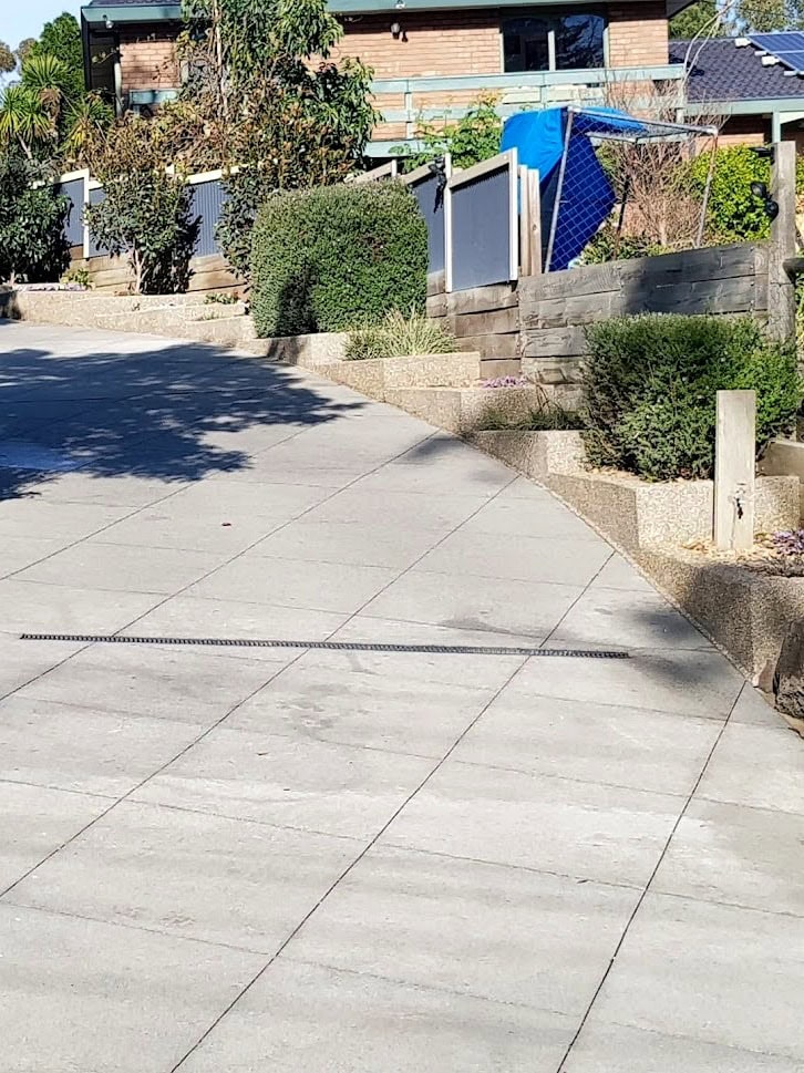 Concrete driveway before cut stone resurfacing Melbourne worn plain concrete surface