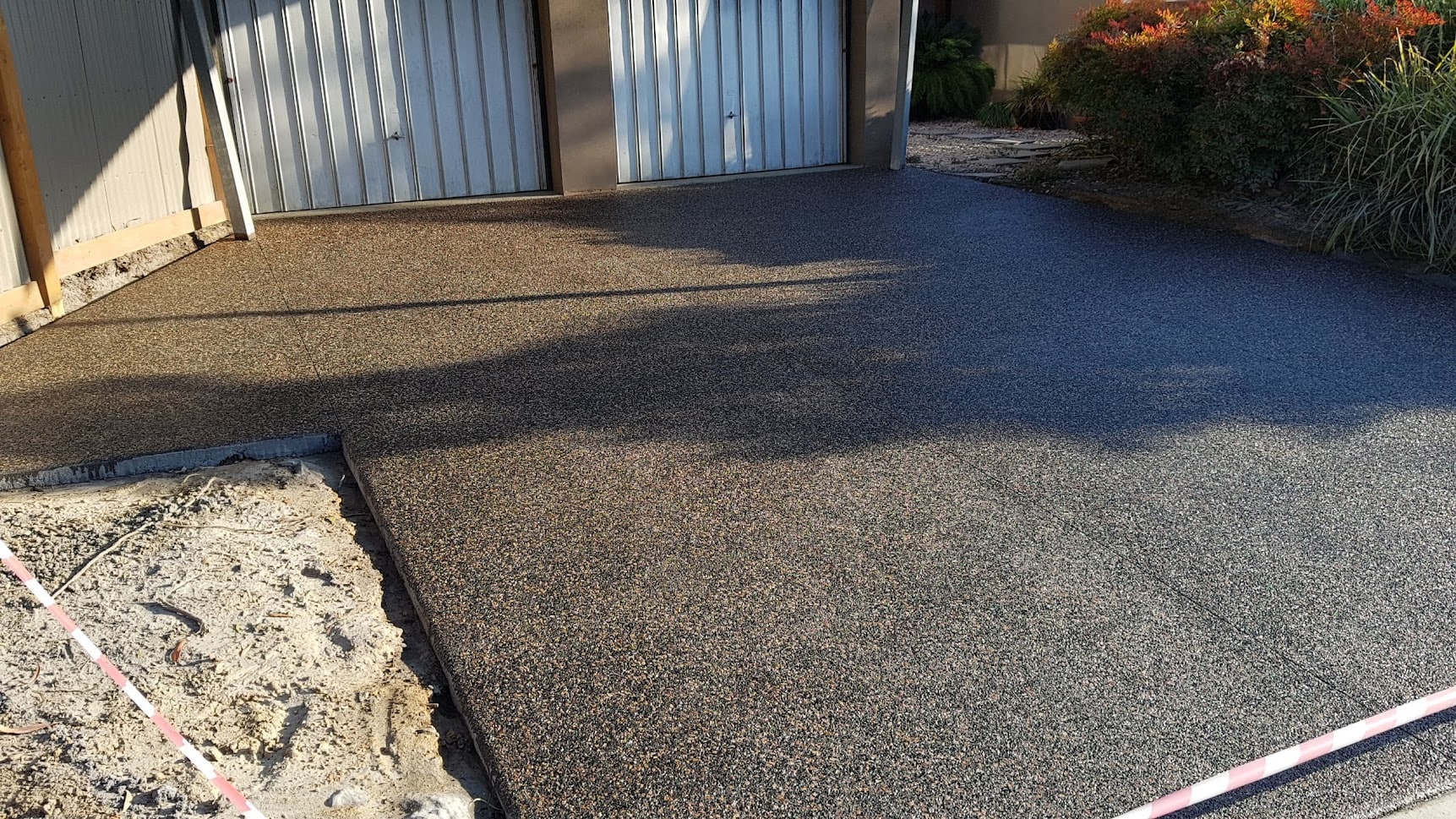 Exposed aggregate concrete driveway resurfacing