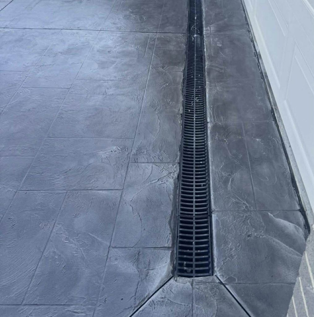 Slate impression concrete resurfacing driveway Melbourne with drainage channel