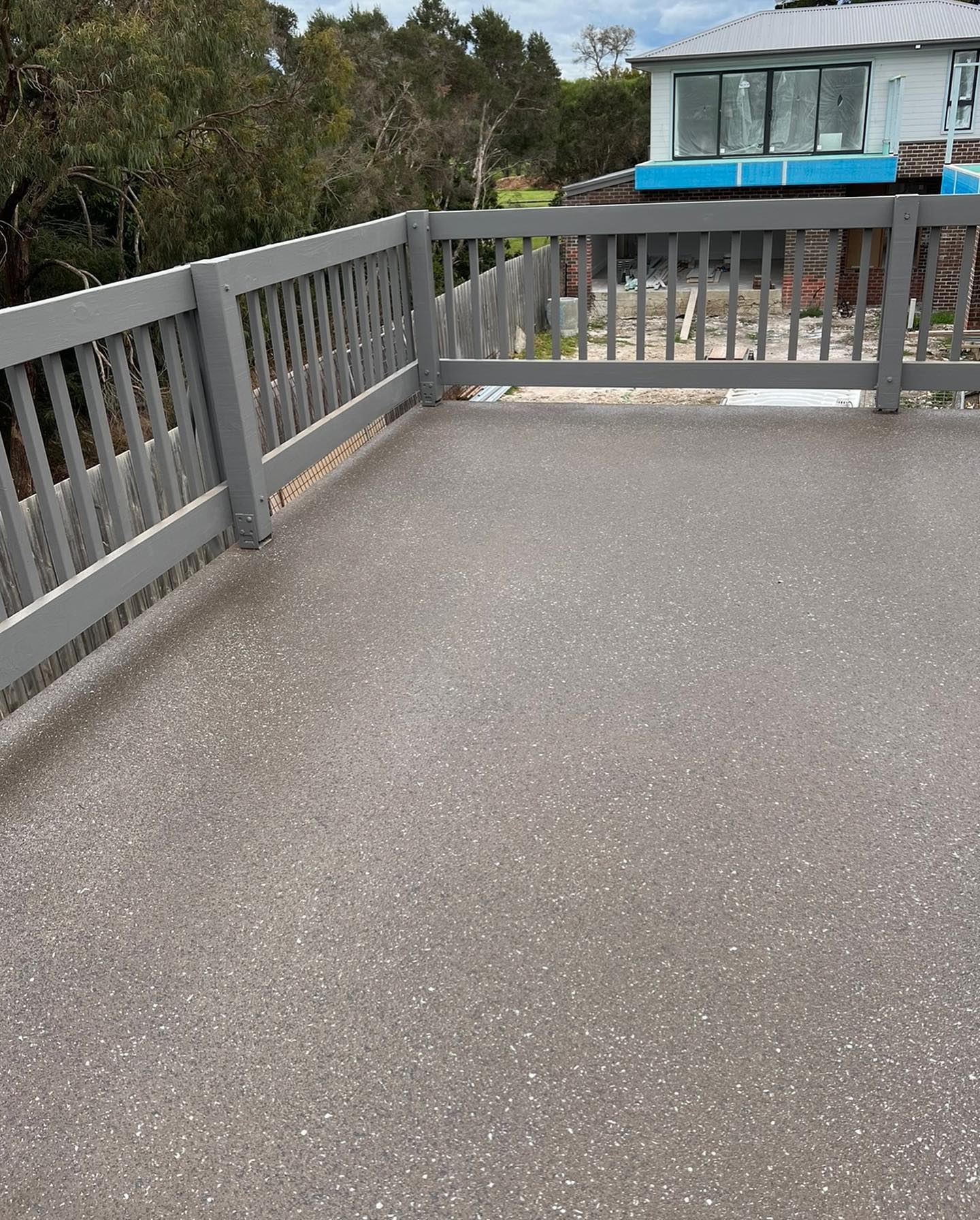 Decorative spray-on concrete paving driveway