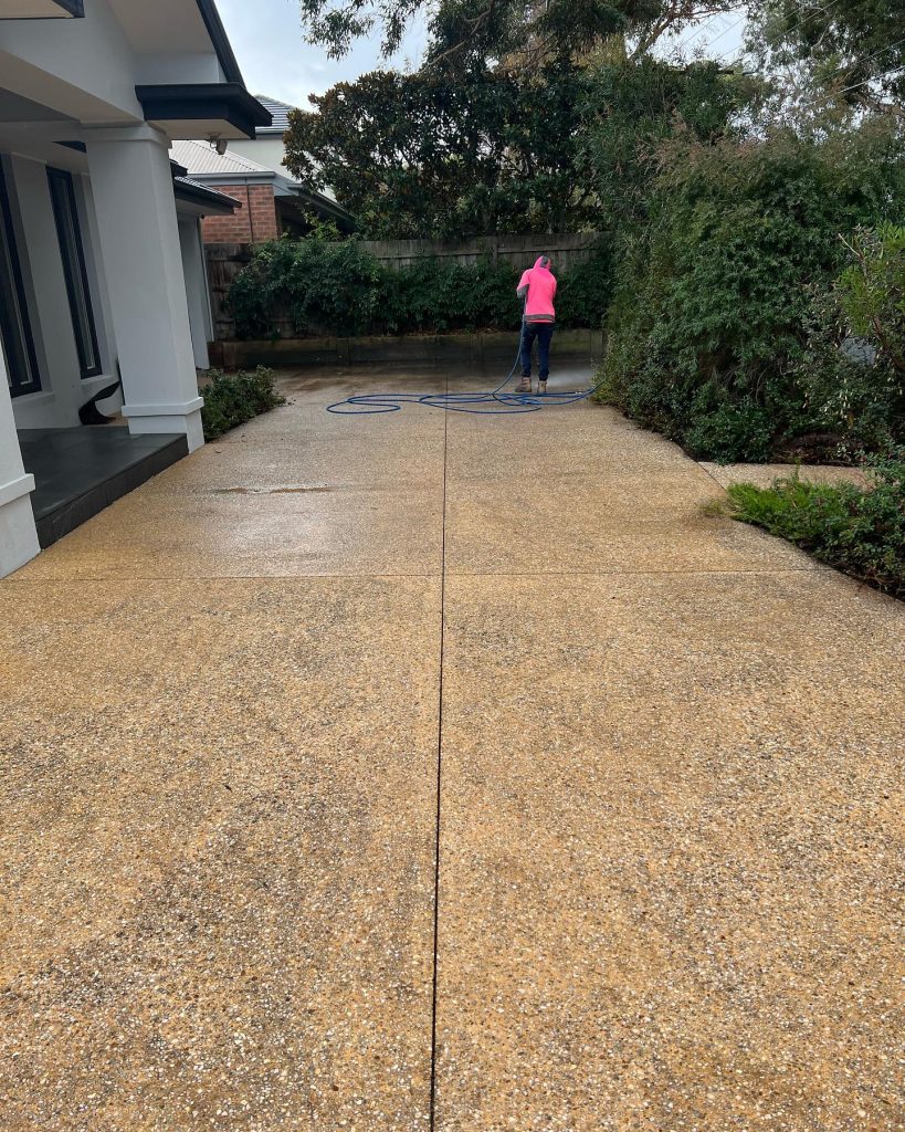 Concrete driveway resurfacing before Bayside Melbourne worn surface exposed aggregate preparation