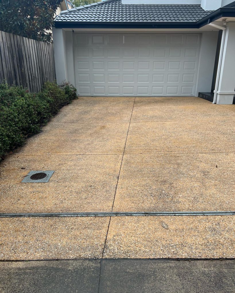 Exposed aggregate driveway resurfacing before Bayside Melbourne worn concrete surface