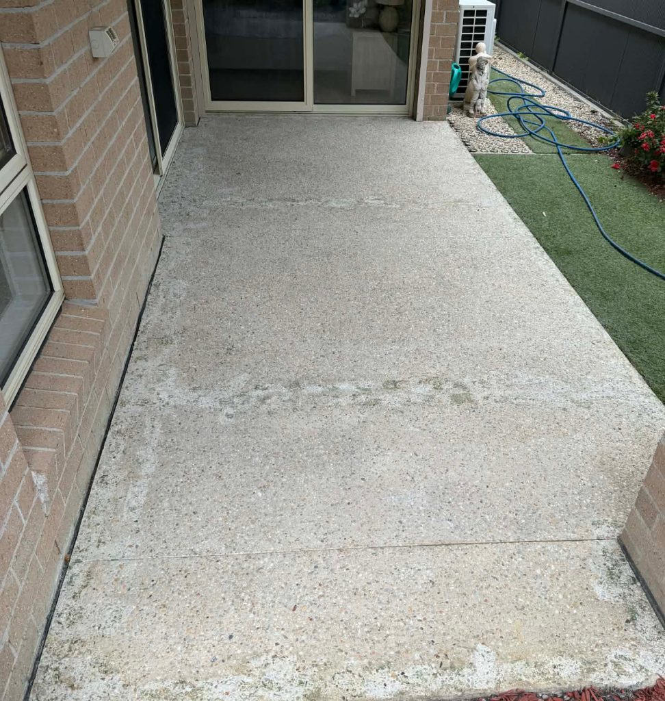 worn exposed aggregate patio before resealing Melbourne
