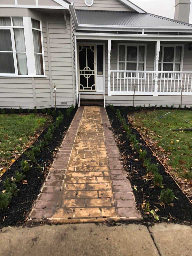 Coloured concrete path in Pakenham before cleaning and sealing