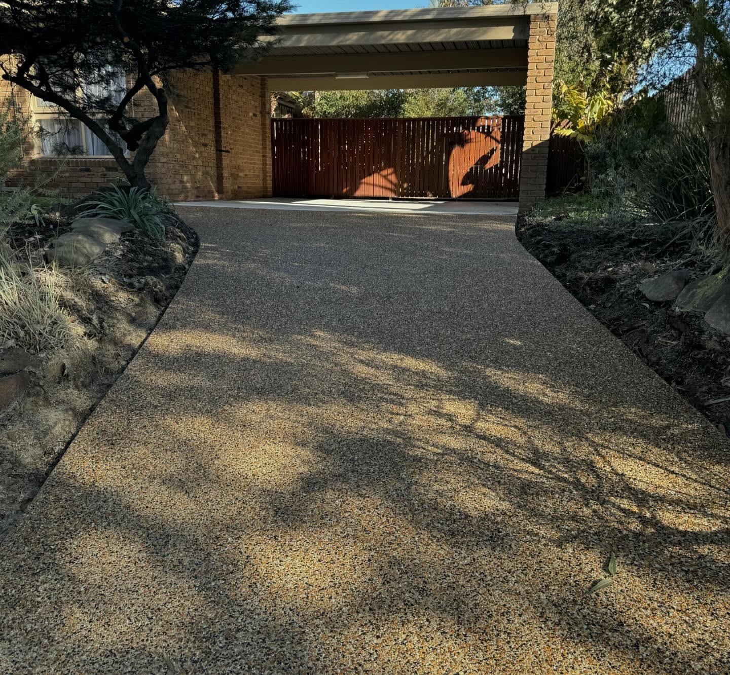 Exposed aggregate concrete driveway resurfacing