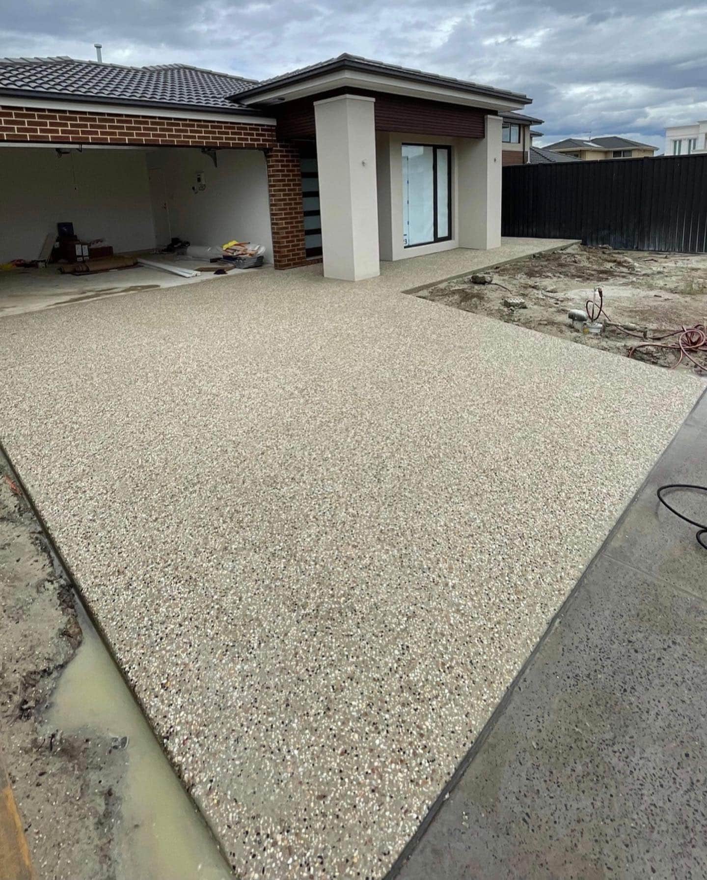 Exposed aggregate concrete driveway resurfacing
